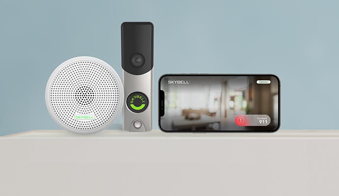 A doorbell button with a camera, a chime unit, and a smartphone showing a live view of the door