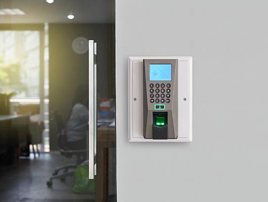 Fingerprint access control system on a wall