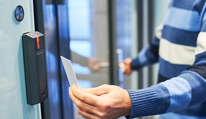 Person using card reader for access