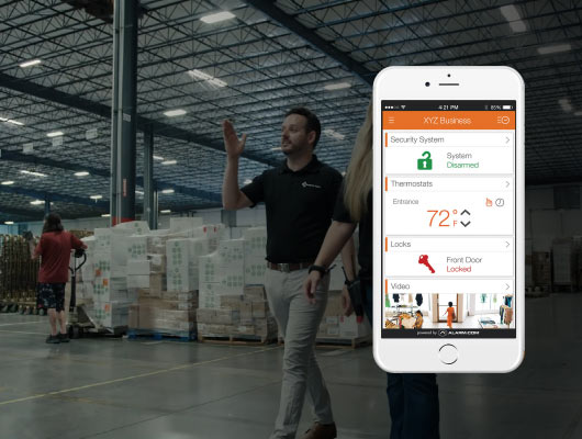 Smartphone with security app in warehouse